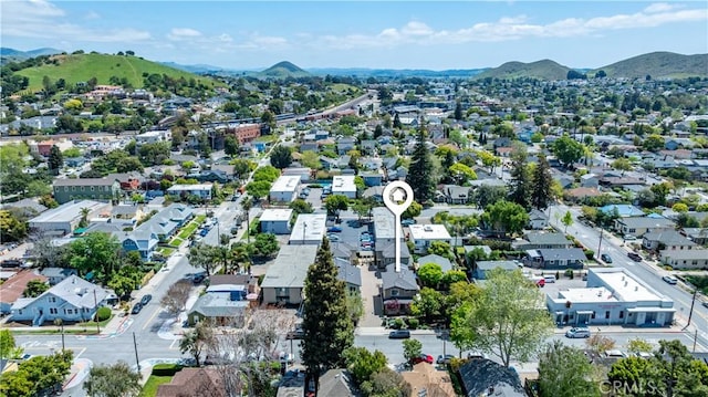 aerial view with a mountain view and a residential view