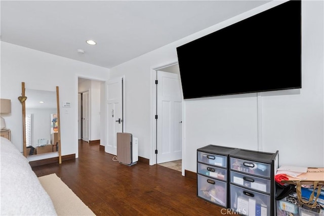 bedroom featuring recessed lighting and dark wood-style flooring