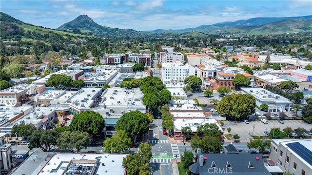 birds eye view of property with a mountain view