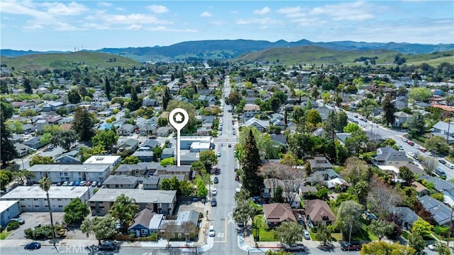 drone / aerial view with a residential view and a mountain view
