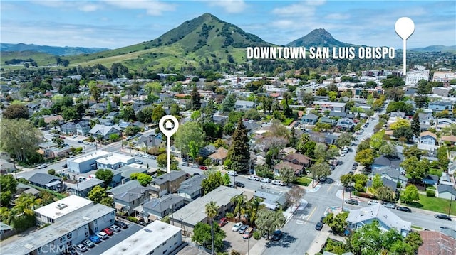 birds eye view of property with a mountain view and a residential view