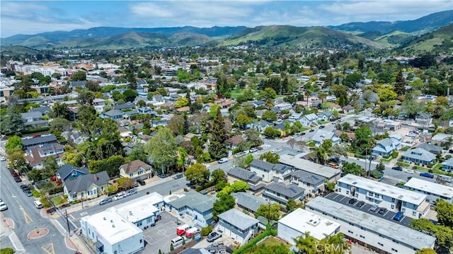 birds eye view of property with a mountain view