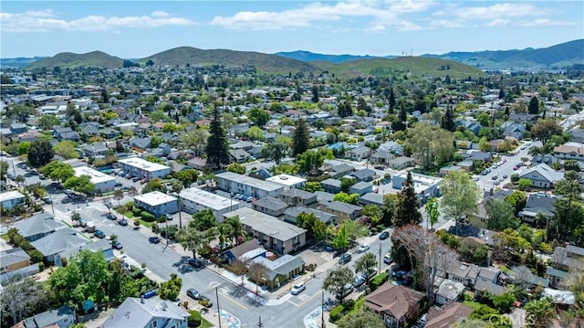 birds eye view of property with a mountain view and a residential view