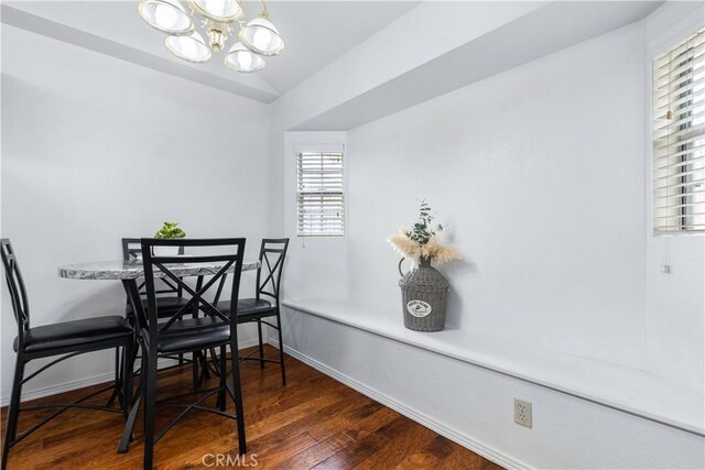 41 Thomas Ct, Templeton, CA 93465 - dining area featuring a chandelier, hardwood / wood-style flooring, baseboards, and vaulted ceiling
