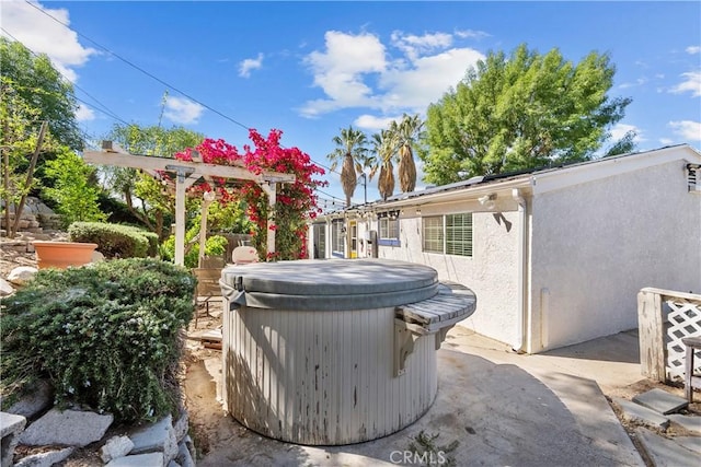 view of patio with a hot tub