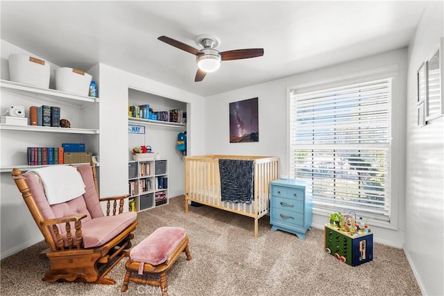 bedroom featuring baseboards, a ceiling fan, and carpet floors