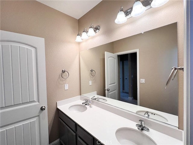 full bath with double vanity and a sink
