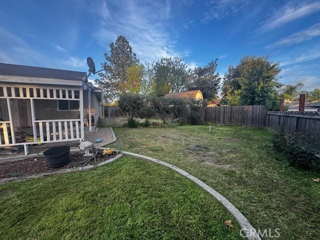 view of yard with a patio and a fenced backyard