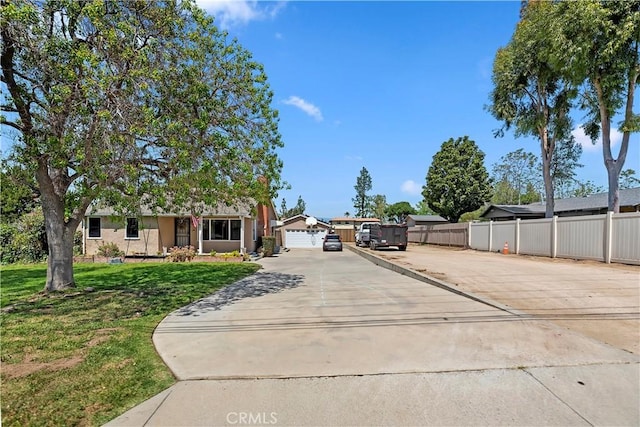 22432 Van Buren St, Grand Terrace, CA 92313 - view of front of house with concrete driveway, a garage, fence, and a front yard