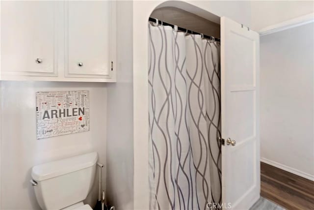 22432 Van Buren St, Grand Terrace, CA 92313 - full bathroom featuring toilet, baseboards, and wood finished floors