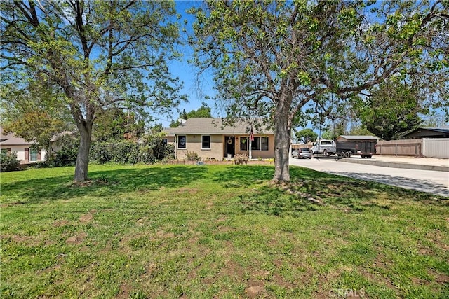 22432 Van Buren St, Grand Terrace, CA 92313 - view of front of home with fence, a front yard, and driveway