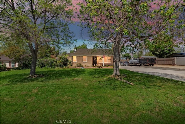 22432 Van Buren St, Grand Terrace, CA 92313 - ranch-style home featuring fence, a front lawn, and driveway