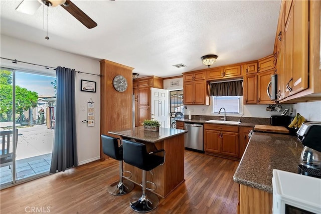 22432 Van Buren St, Grand Terrace, CA 92313 - kitchen featuring a ceiling fan, a sink, dark wood finished floors, visible vents, and appliances with stainless steel finishes