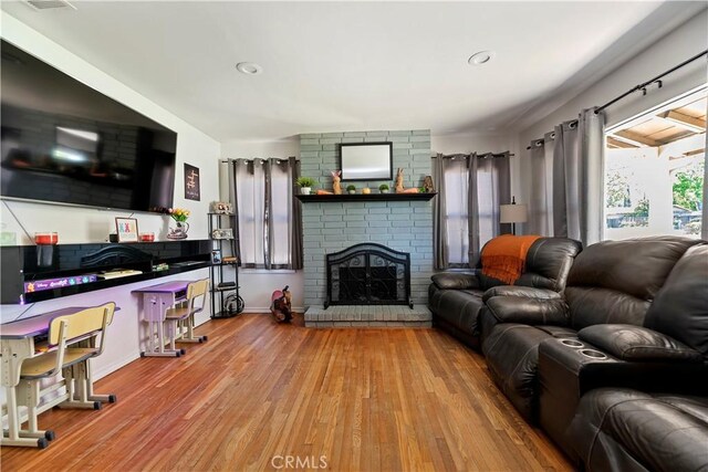 22432 Van Buren St, Grand Terrace, CA 92313 - living room featuring a fireplace, recessed lighting, baseboards, and wood finished floors