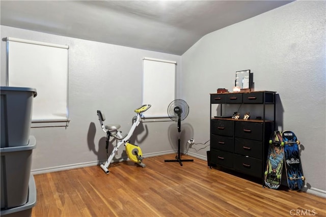 22432 Van Buren St, Grand Terrace, CA 92313 - misc room with baseboards, vaulted ceiling, and wood finished floors