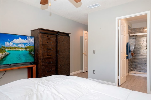 bedroom with visible vents, baseboards, ceiling fan, and wood finished floors