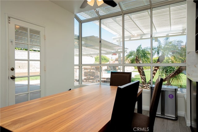 dining area featuring ceiling fan and wood finished floors