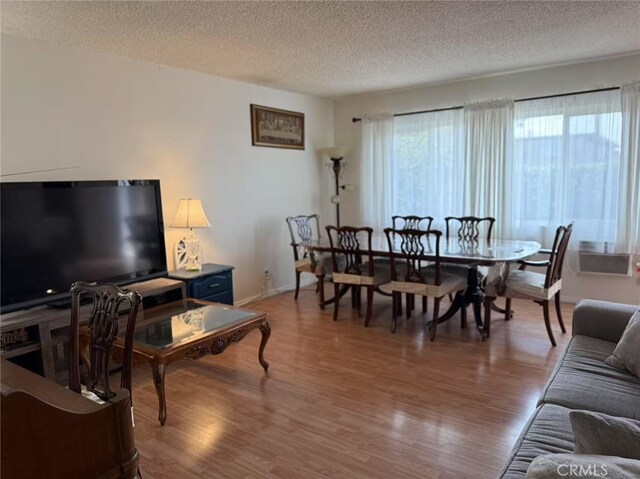 745 S Chapel Ave, Alhambra, CA 91801 - living room with baseboards, a textured ceiling, and light wood finished floors