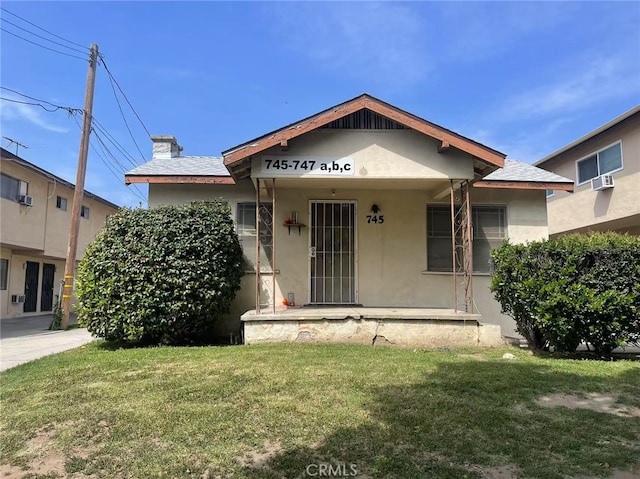 745 S Chapel Ave, Alhambra, CA 91801 - bungalow-style home featuring a front lawn, stucco siding, and covered porch