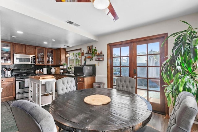 dining room featuring recessed lighting and wood finished floors