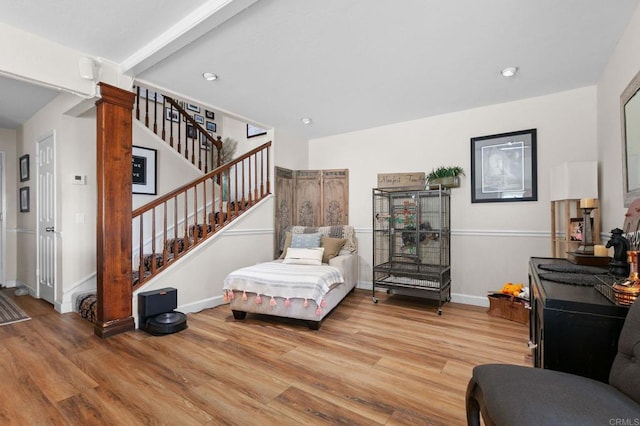 sitting room with light wood-style floors, stairway, baseboards, and recessed lighting