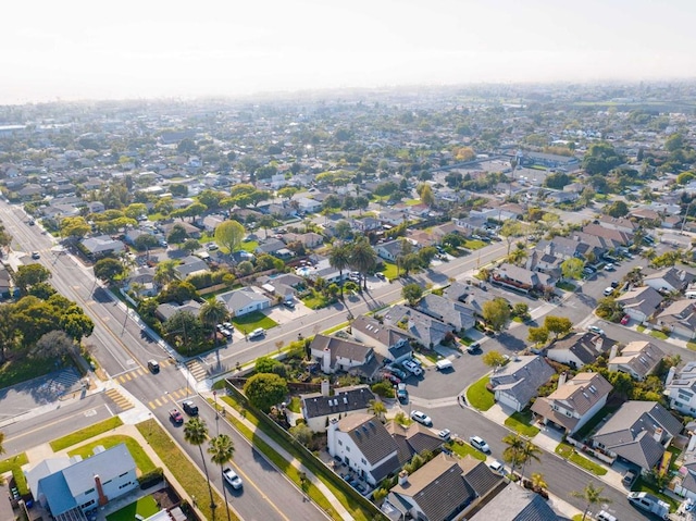 aerial view of property and surrounding area with nearby suburban area