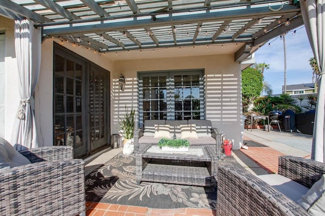 view of patio / terrace with a pergola, an outdoor living space, and french doors