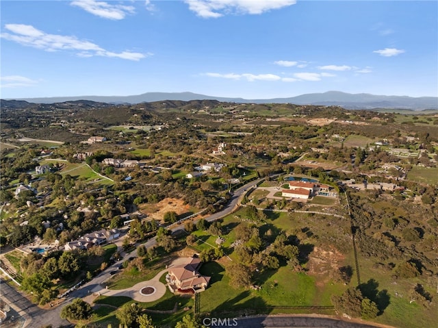 drone / aerial view featuring a mountain view
