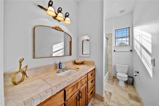 full bathroom featuring visible vents, toilet, vanity, and baseboards