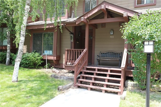 755 Cienega Rd Unit B, Big Bear Lake, CA 92315 - view of exterior entry featuring a yard and a porch