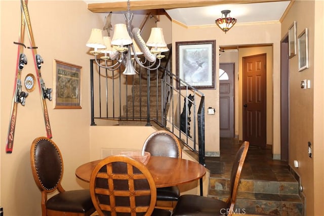 755 Cienega Rd Unit B, Big Bear Lake, CA 92315 - dining area with crown molding, stone finish floor, a notable chandelier, and baseboards