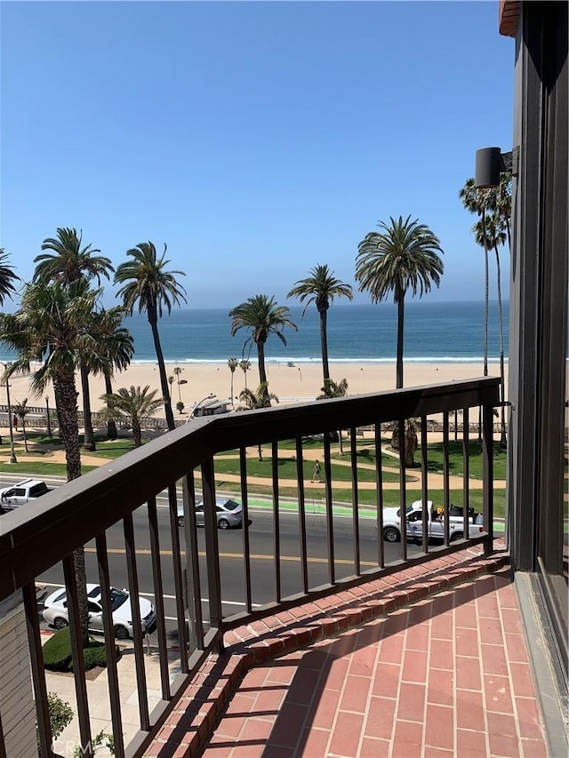 balcony with a view of the beach and a water view