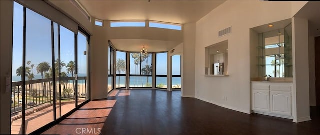 interior space with visible vents, a wealth of natural light, and an inviting chandelier