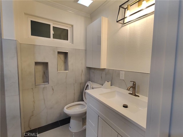 746 Hudson Ave, Costa Mesa, CA 92626 - bathroom featuring crown molding, tile walls, vanity, and toilet