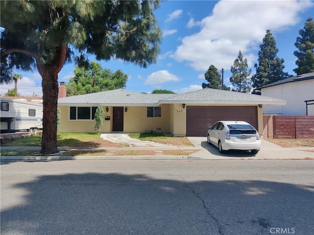 746 Hudson Ave, Costa Mesa, CA 92626 - ranch-style house with a garage, fence, stucco siding, a chimney, and concrete driveway