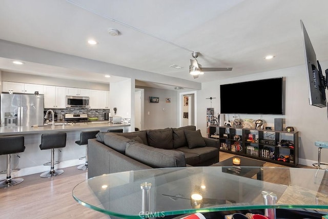 1192 Mitchell Ave Unit 66, Tustin, CA 92780 - living room featuring light wood-type flooring, recessed lighting, and a ceiling fan