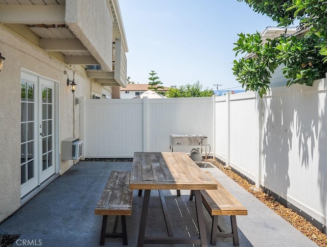 1192 Mitchell Ave Unit 66, Tustin, CA 92780 - view of patio featuring french doors and outdoor dining area