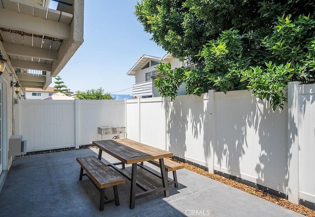 1192 Mitchell Ave Unit 66, Tustin, CA 92780 - fenced backyard featuring outdoor dining space and a patio area