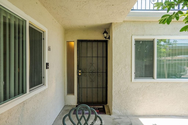 1192 Mitchell Ave Unit 66, Tustin, CA 92780 - doorway to property featuring stucco siding