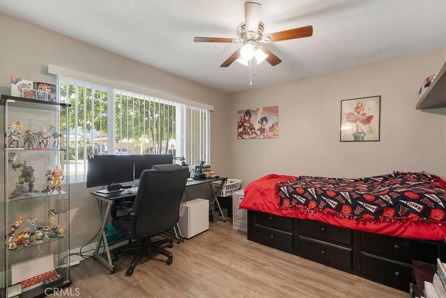 1192 Mitchell Ave Unit 66, Tustin, CA 92780 - bedroom with wood finished floors and a ceiling fan