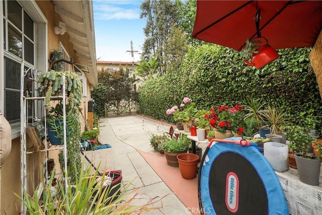 view of patio / terrace featuring fence