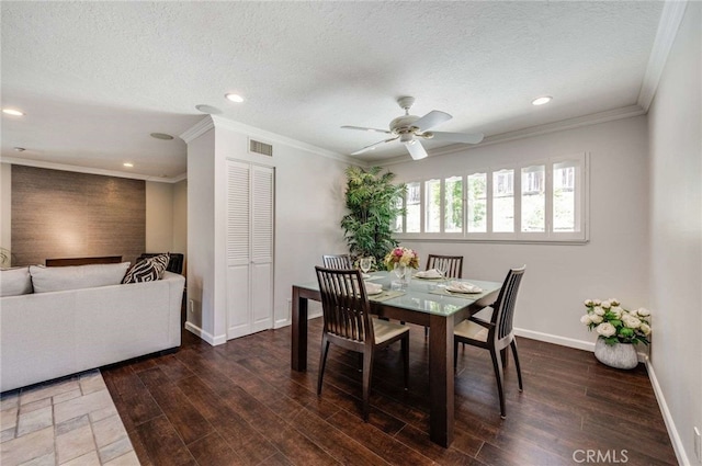 dining room with ceiling fan, baseboards, ornamental molding, and visible vents