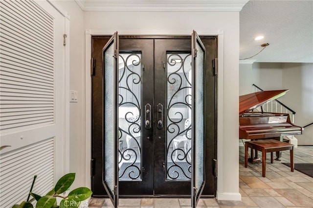 details featuring french doors and ornamental molding