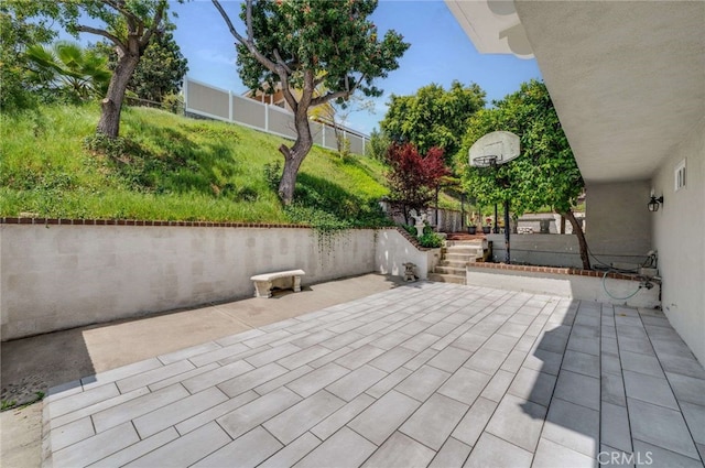 view of patio / terrace featuring fence