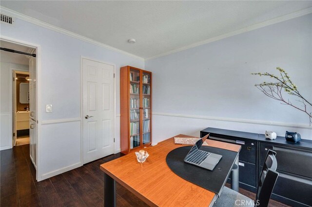 office area featuring ornamental molding, hardwood / wood-style floors, and visible vents