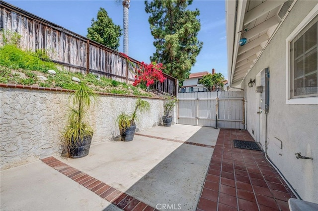 view of patio / terrace with fence and a gate