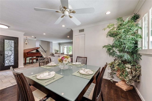 dining room featuring ceiling fan, ornamental molding, visible vents, recessed lighting, and stairs