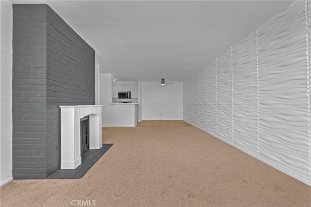 28121 Highridge Rd Unit 402, Rancho Palos Verdes, CA 90275 - unfurnished living room with a fireplace with flush hearth, baseboards, and carpet
