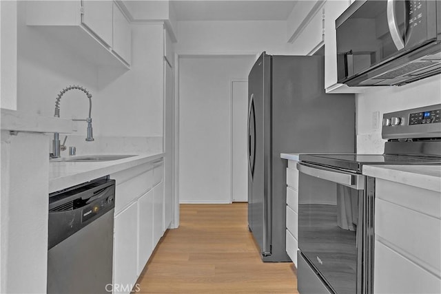 28121 Highridge Rd Unit 402, Rancho Palos Verdes, CA 90275 - kitchen with a sink, light countertops, white cabinetry, and stainless steel appliances