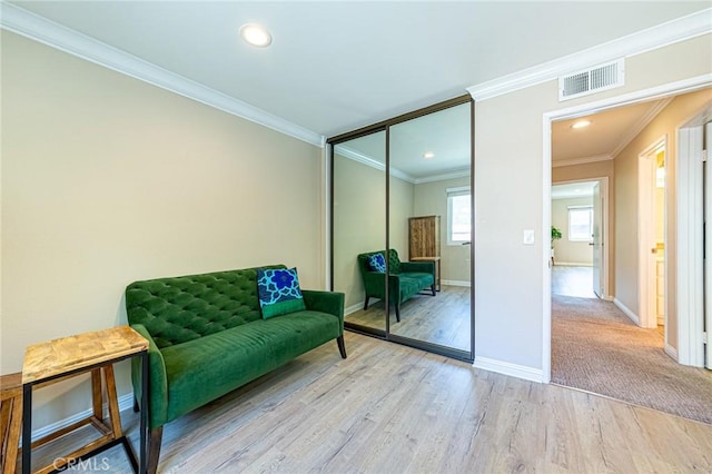 2735 Piedmont Ave Unit 3, Montrose, CA 91020 - living area with crown molding, visible vents, recessed lighting, wood finished floors, and baseboards